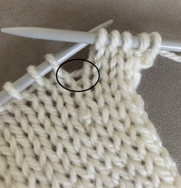 loop between two knitting stitches