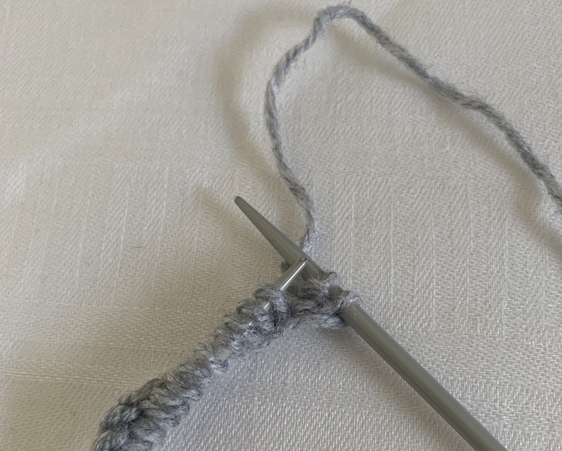 move wool to the back of rib work 